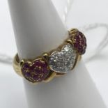 A 9ct gold Diamond and Ruby cluster Heart shaped ring. Size L.