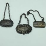 A Lot of 3 various Georgian silver drinks labels. Includes two Sheffield silver labels. (3)