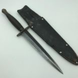 Post War 3rd pattern Fairbairn Sykes knife with leather sheath.