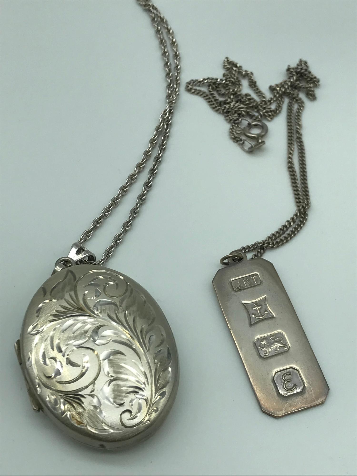 Sheffield silver ornate engraved locket with silver chain together with Birmingham silver Ingot