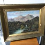 A Large antique oil on canvas depicting Scottish mountain scene signed M Barratt. Fitted within an