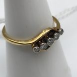 18ct gold ladies ring designed with 5 bright diamonds. Size O.