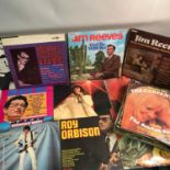 A Lot of records which includes Elvis, Buddy Holly, Jim Reeves etc