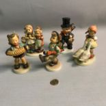 A lot of 5 Goebel Hummel boy and girls figures. (2 damaged)