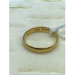 A 22ct Gold wedding band, size M. 3.85Grams