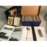 A large quantity of various postcards together with a presented collection of black and white