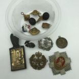 A Lot of military cap badges to include Greenock Burgh Police badge