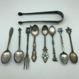 A Selection of various 800 grade and sterling silver souvenir spoons, Together with ornate sugar