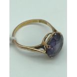 Egyptian gold hall marked ring set with a large blue topaz stone. Size N.