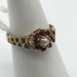 A 9ct gold Single pearl and Garnet cluster ring. Size L.