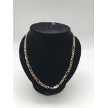 A 9ct gold Figaro chain. Weighs 7.65grams
