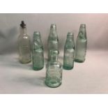 A lot of six vintage glass advertising bottles, four are from Edinburgh based companies