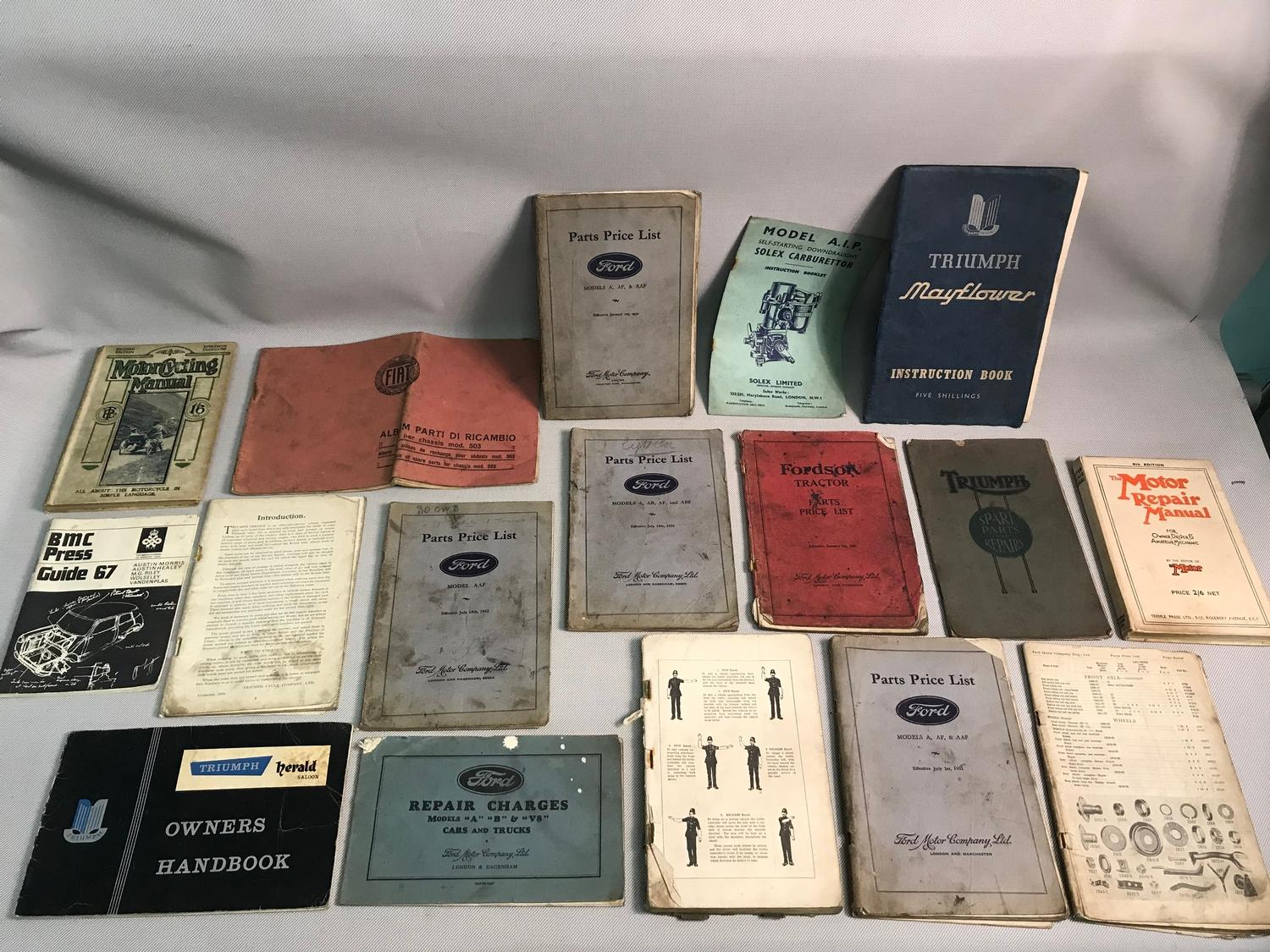 A Lot of vintage motor manuals which includes Fiat, Triumph, Ford and Fordson tractor manual