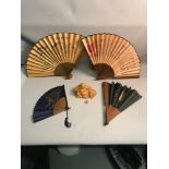 A Lot of 4 Chinese hand painted fans together with wooden carved laughing buddha