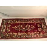 A Victorian red velvet table throw, Ornately embroidered with metal threads to the trims and main