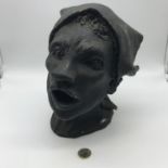 An unsigned head clay sculpture. Measures 23cm in height