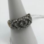 A 9ct gold and diamond set ring. Size M.