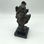 An Art Nouveau bronze bust signed Henry Jacobs (1864-1935). A study of a young girl sat upon a