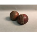 A vintage practice cricket ball and one other