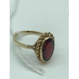 A Beautiful example of a ladies 9ct gold ring set with a large oval shaped Garnet stone. Size N