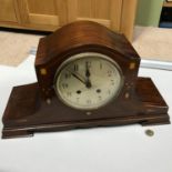 AN Edwardian inlaid Mahogany mantle clock, In a working condition with key.