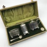 A Birmingham silver condiment set with Spoon, Makers Charles Turman Burrow & Son