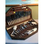 Turner & Co Sheffield large cutlery set, fitted within an oak display case.