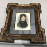 A Victorian painted lady portrait possibly done on milk glass or ceramic, Fitted within a wooden