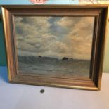 Gilt framed oil painting depicting ocean and sky scene by J G Russell dated 1936, Frame measures