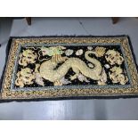 A 20th century hand made Chinese Dragon design rug/ wall hanger. Measures 158x83cm includes black