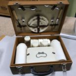 A Vintage Brexton picnic carry case complete with utensils