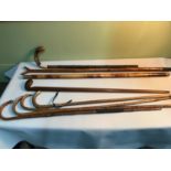 A collection of vintage walking canes, to include a rare golf club walking stick, bamboo stick