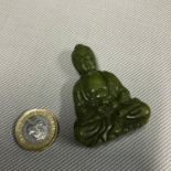 A Carved Jade oriental God ingot