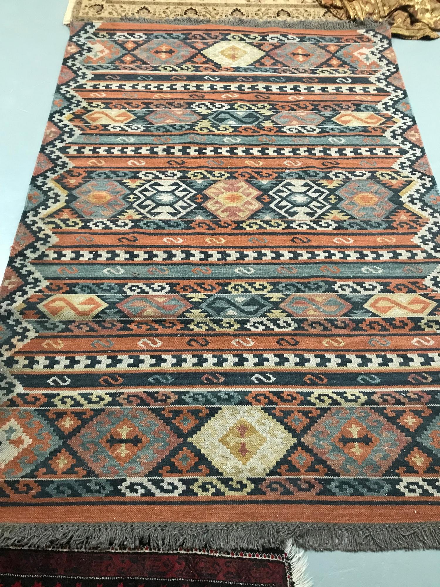 A Large hand woven Aztec style rug, Measures 241x168cm