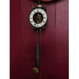 A Vintage Tempus Fugit skeleton wall clock with pendulum and weight, In a working condition.