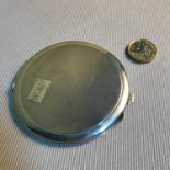 A Birmingham silver compact made by Barker Brothers Silver Ltd. Measures 8.5cm in diameter