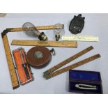 A Quantity of various odds which includes two vintage bulbs, 4 Various sized rulers & 33ft Lufkin