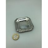 A 800 Grade Continental silver tray. Measures 0.5x7x7cm