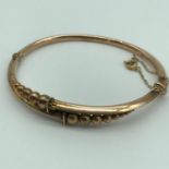 A Victorian 9ct gold bangle, weighs 6.44grams