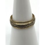 A 9ct gold two tone wedding band, ring size M, Weighs 3GRAMS.