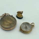 A Small Gold whippet dog seal (green agate), A Small Gold cased compass and 9ct gold (Chester)