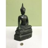 Thai 19th century Bronze sitting Buddha in a Green Patina, Filled, Measures 27cm in height