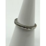 A 9ct white gold cz band ring, Size J.