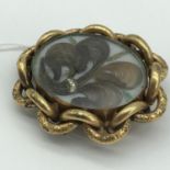 A Large Victorian yellow metal mourning brooch/ pendant.