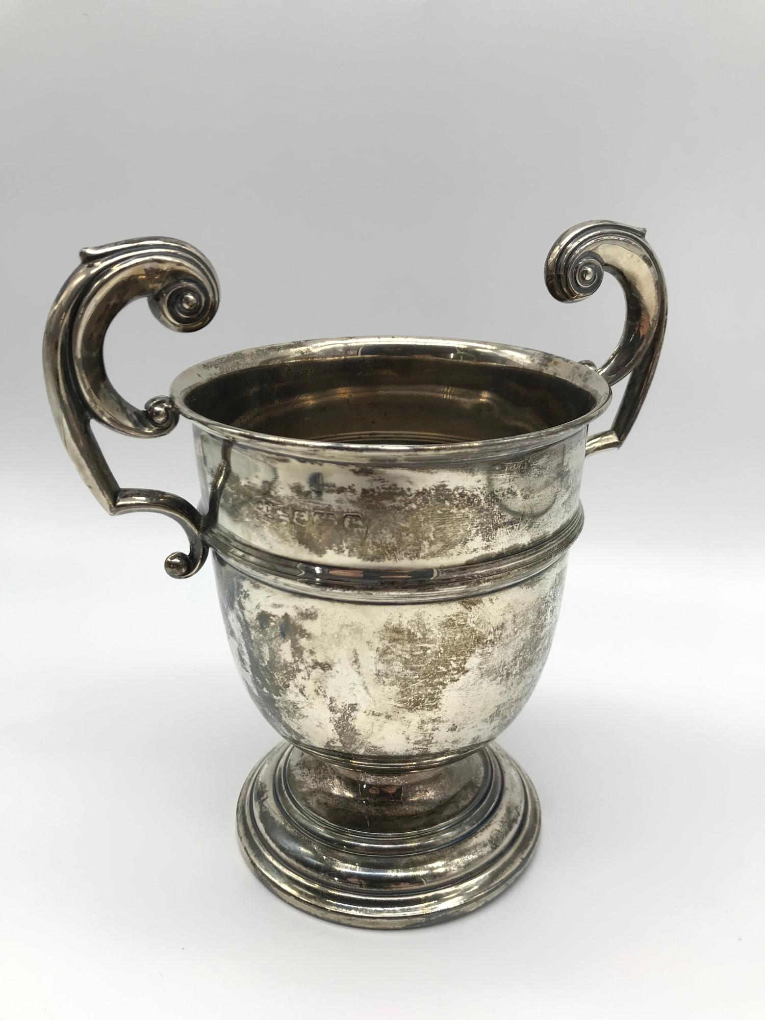 A Birmingham silver two handle trophy, Maker Joseph Gloster Ltd, Measures 16cm in height. weighs 218