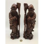 A Pair of Chinese carved hardwood figures of Shou Lao god of longevity, Measure 30cm in height