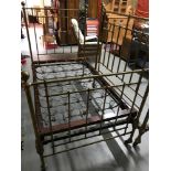 A Victorian 3/4 cast iron and brass bed frame with original sprung base. Measures 180x110cm