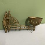 A Victorian cast metal ornate wall paraffin lamp bracket.