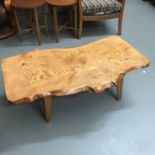 An elm wood top coffee table