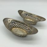 A Pair of pierced Sheffield silver dishes, Maker Henry Atkin, Dated 1899. Total weight 65grams